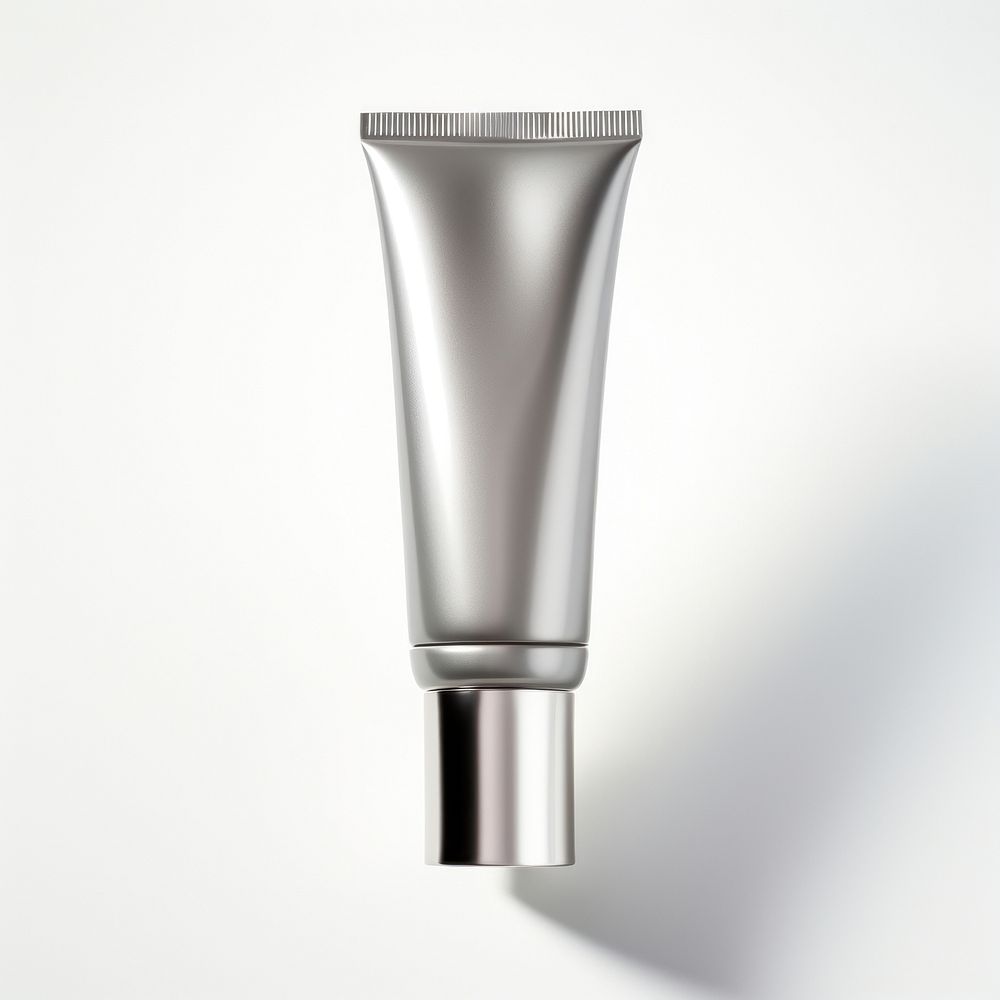 A dark silver cream tube cosmetics bottle white background.