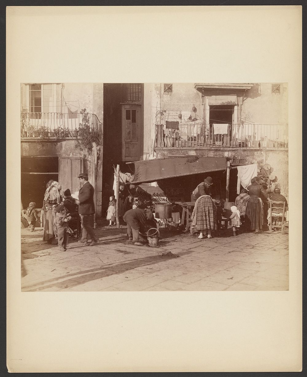Street scene with produce vendor by Giorgio Sommer
