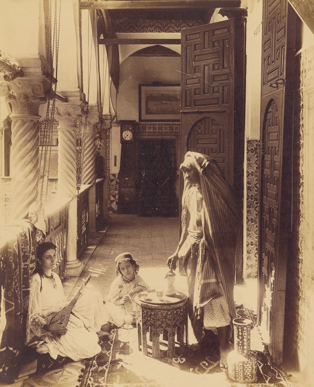 Woman playing sitar with child