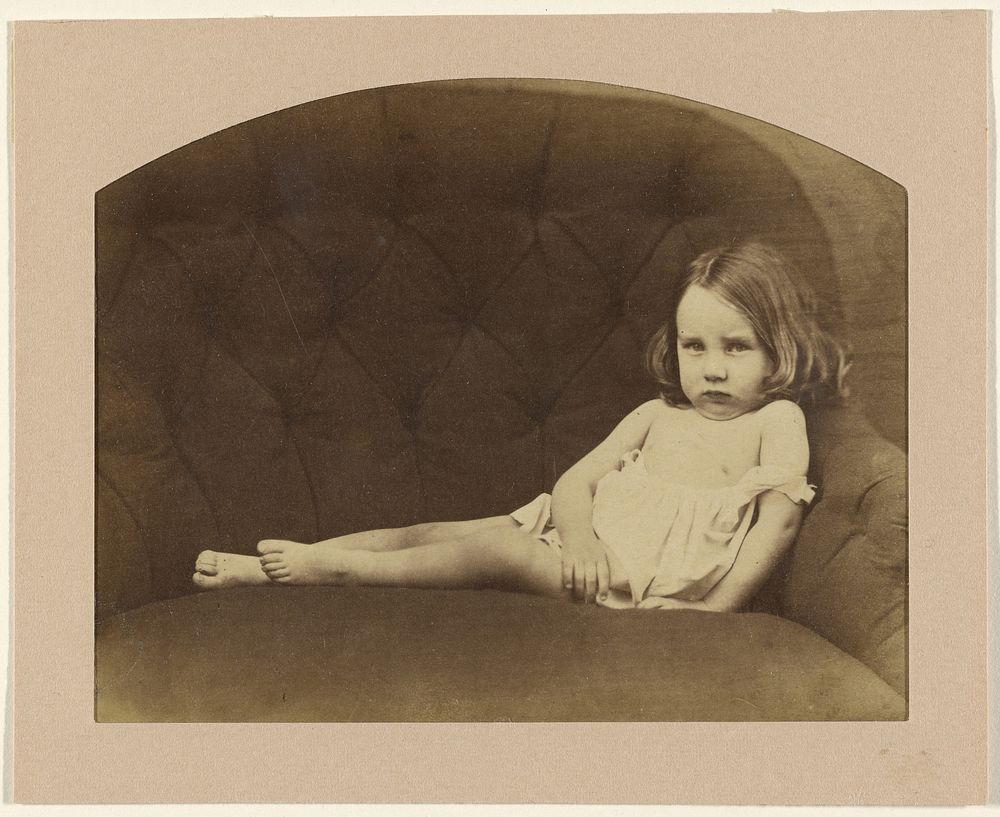 Portrait of a young child on armchair