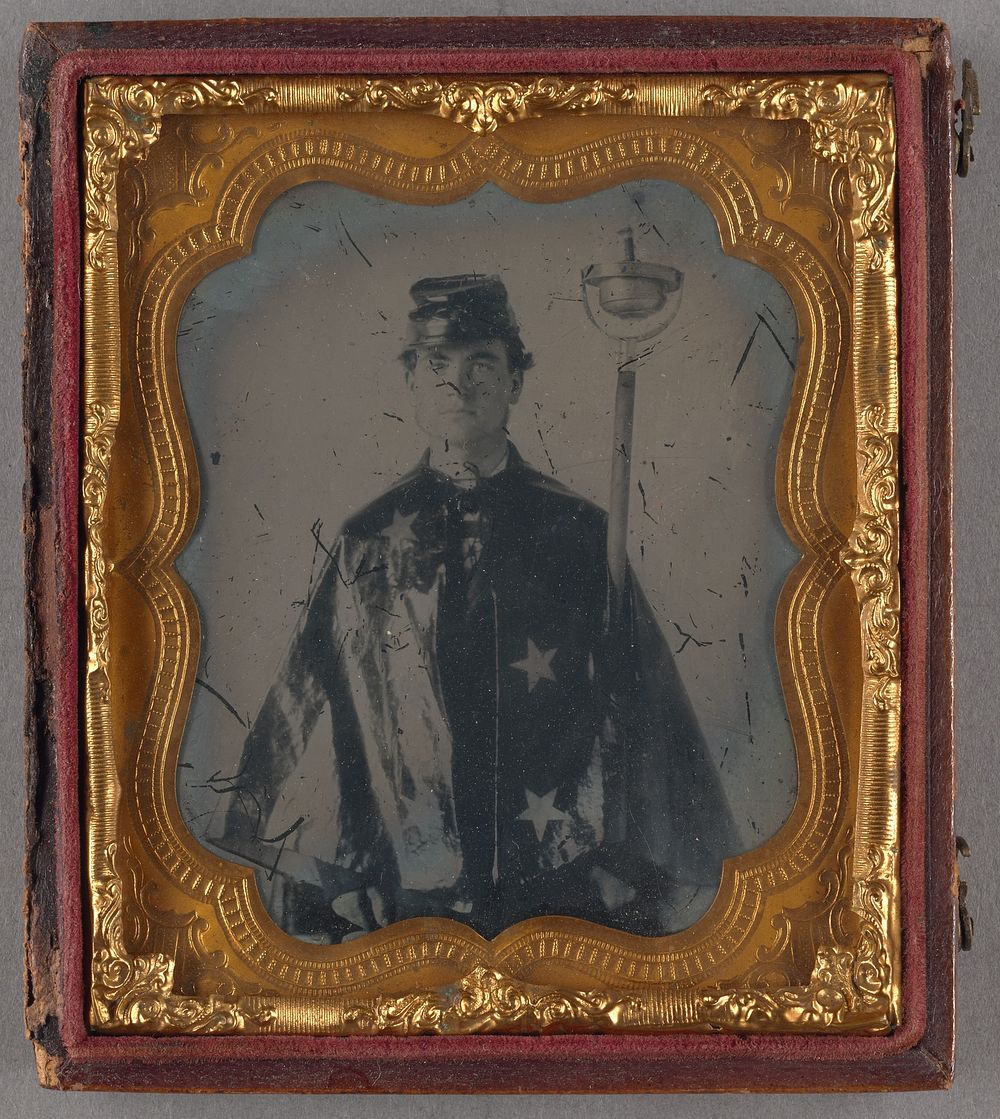 Portrait of a Patriotic Man in Cape with Star Pattern Holding Night Torch