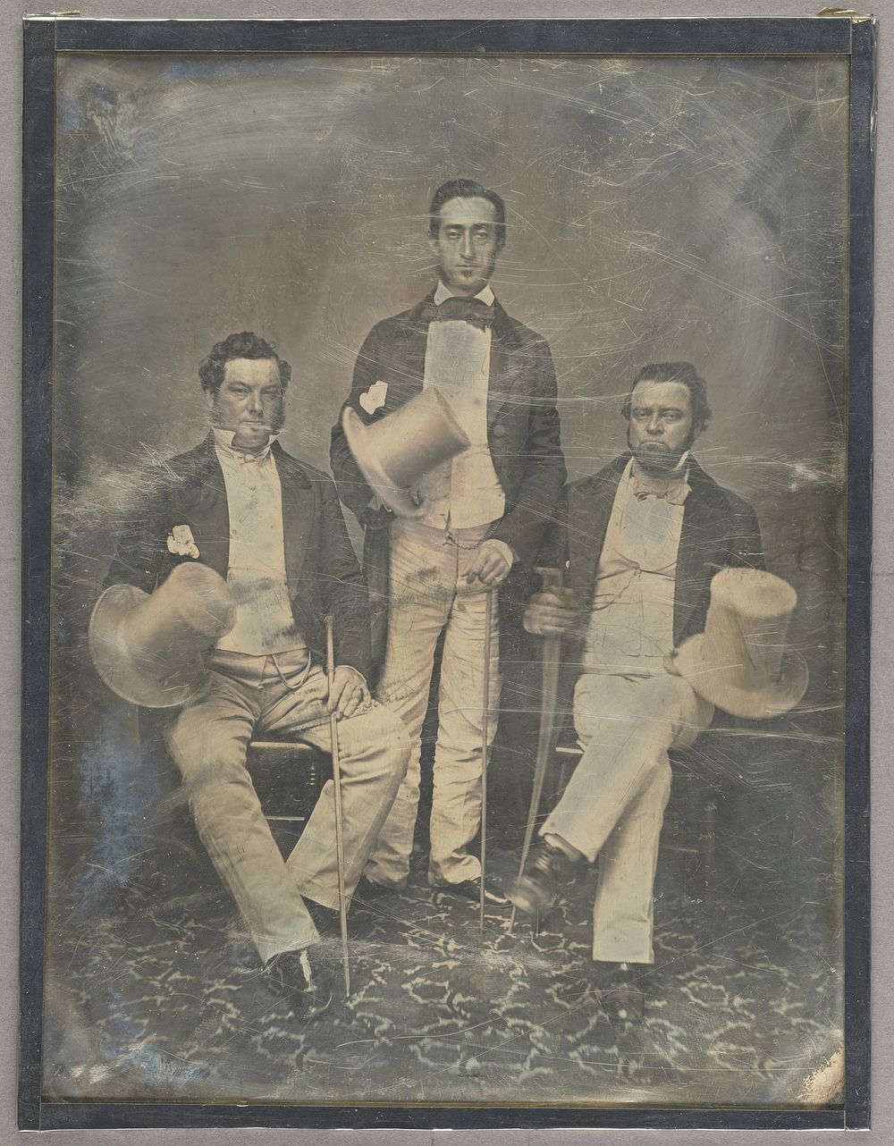 Portrait of Three Men Holding Top Hats