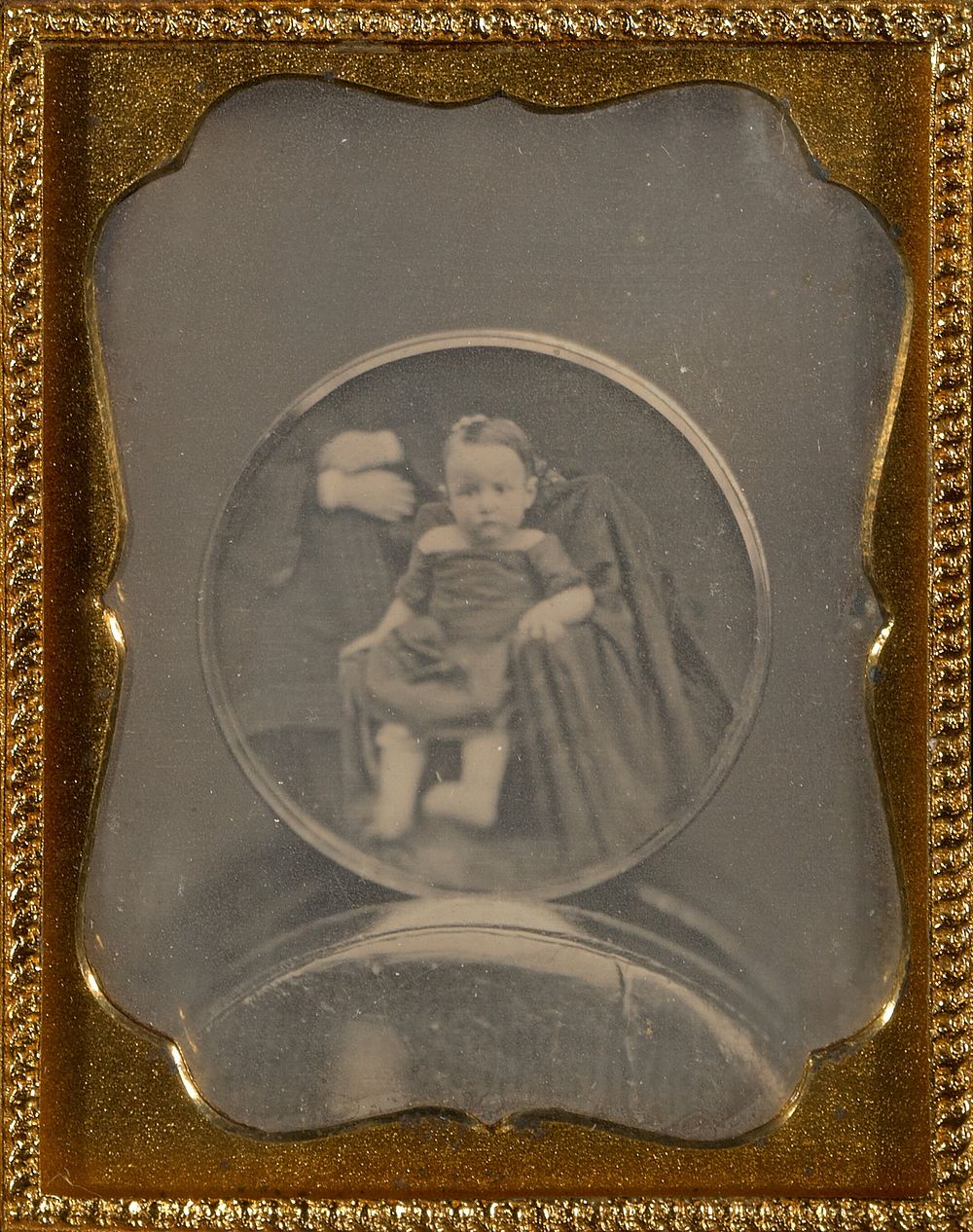 Copy daguerreotype of a circular daguerreotype portrait of a child