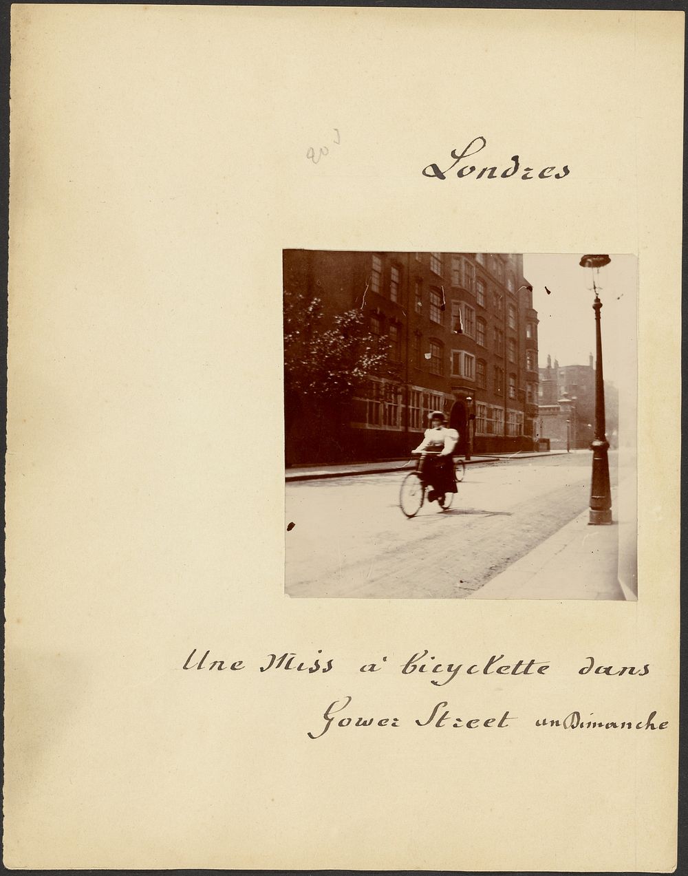Young woman riding bicycle on Gower Street
