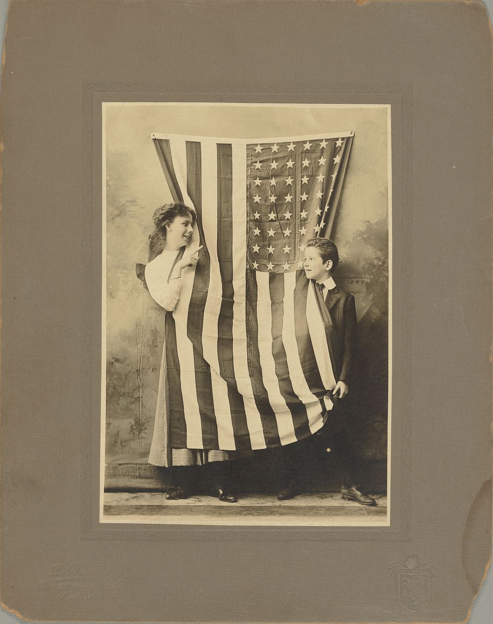Children with American flag by Joseph B DeYoung