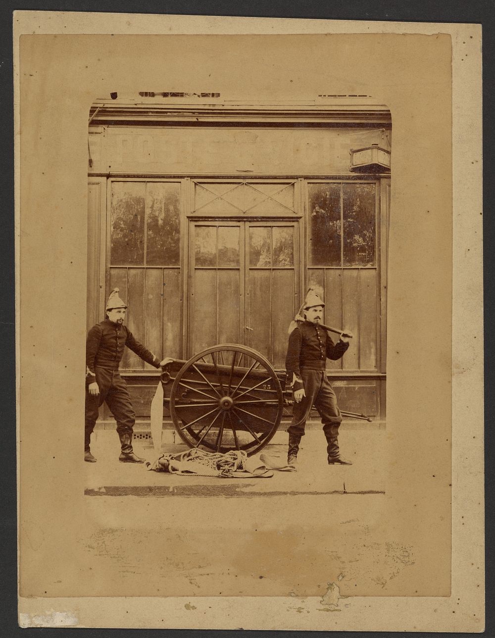Firemen with hose roll