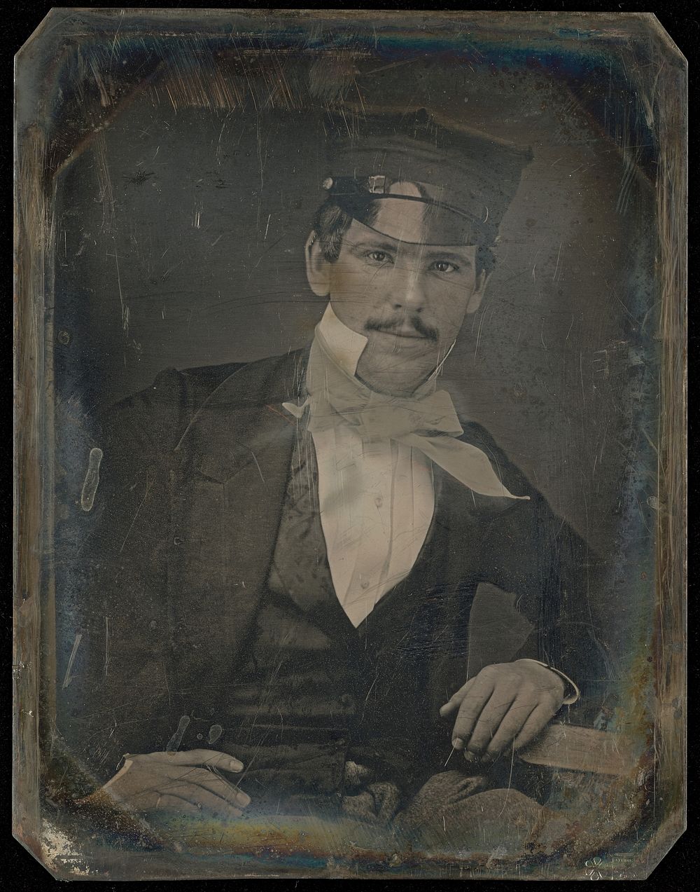 Portrait of a Seated Man with Moustache in Cap