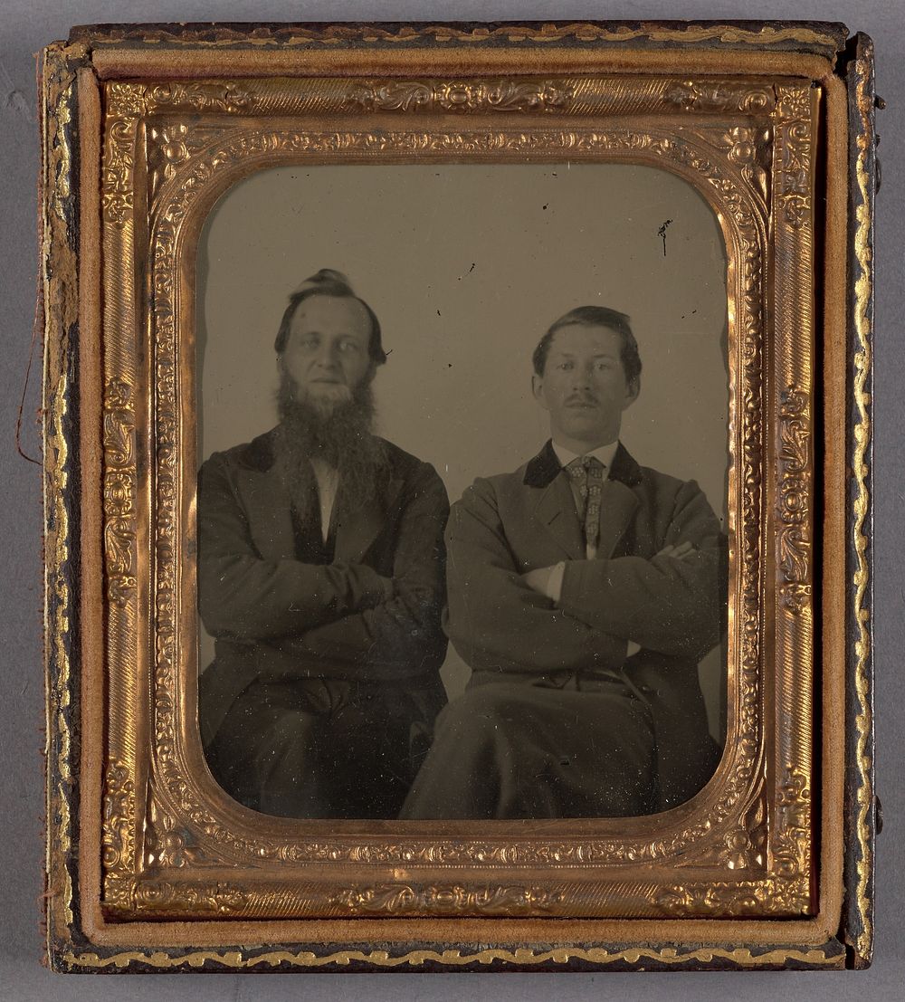 Portrait of Two Seated Men with Their Arms Folded