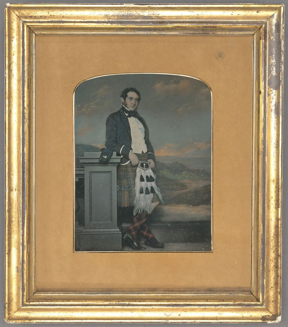 Full-length portrait of a man wearing a kilt