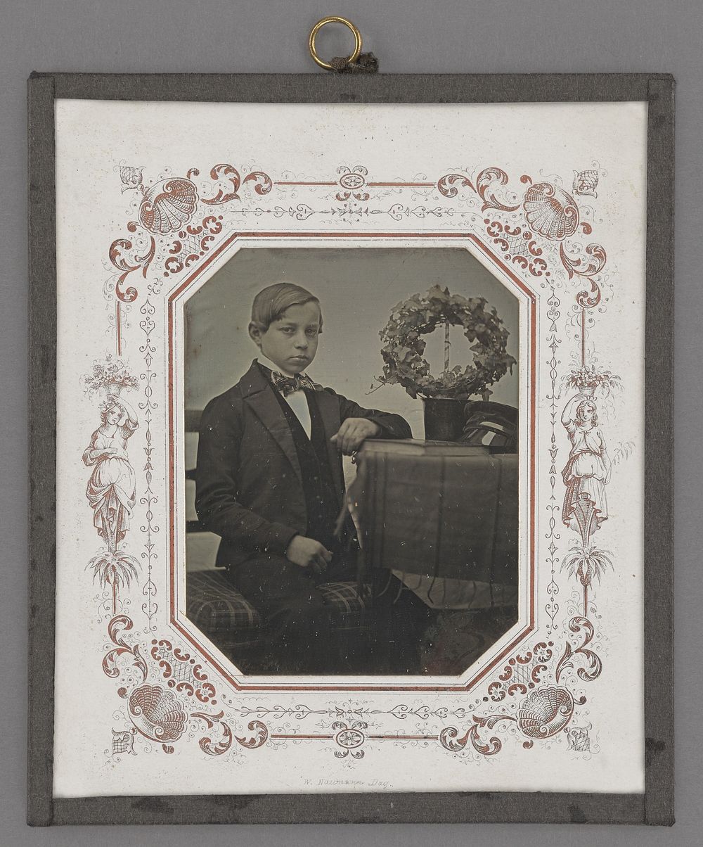 Portrait of a Young Boy Posed by Table with Wreath by W Nauman