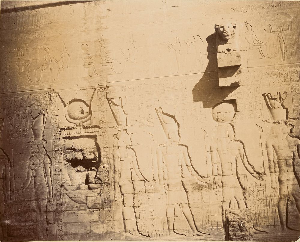 Wall with relief sculptures of ancient Egyptian figures