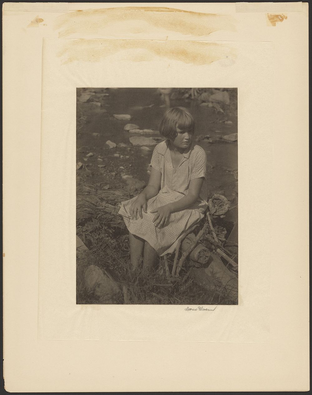 Girl Sitting on Log by Creek by Doris Ulmann