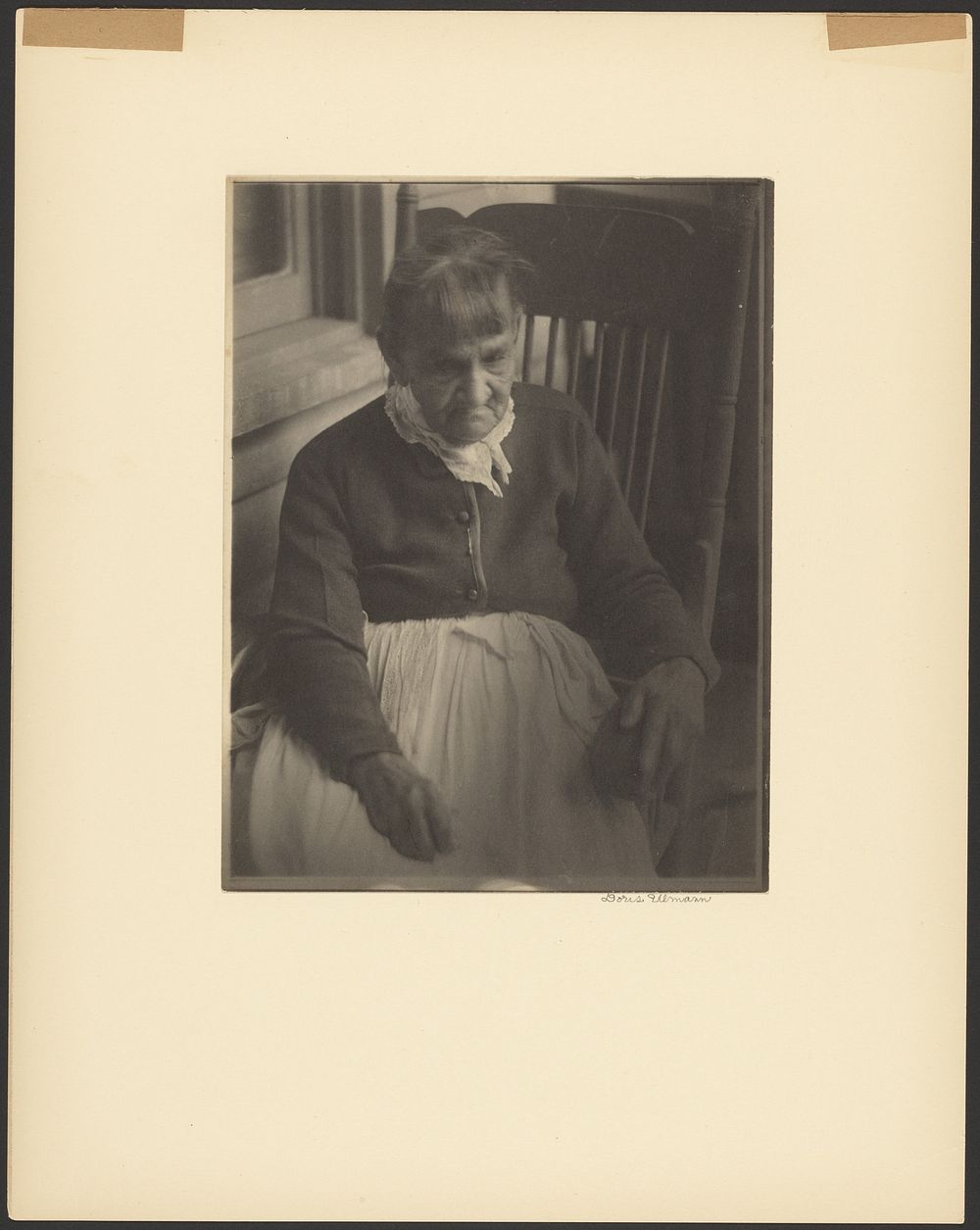 Old Woman Wearing White Apron, Seated by Doris Ulmann
