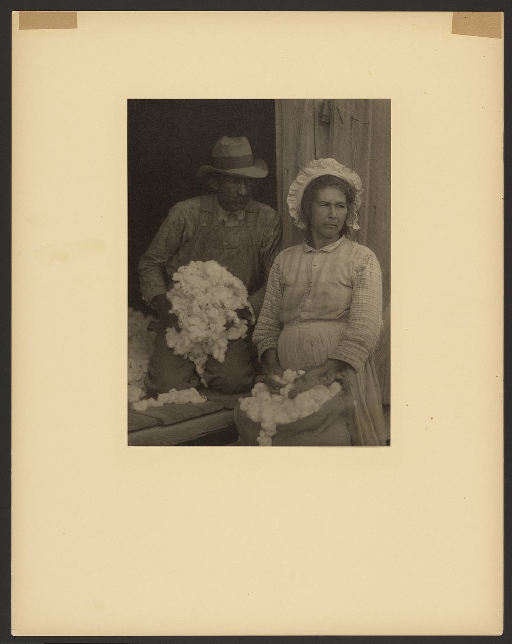 Farm Couple with Picked Cotton, Southeastern U.S. by Doris Ulmann