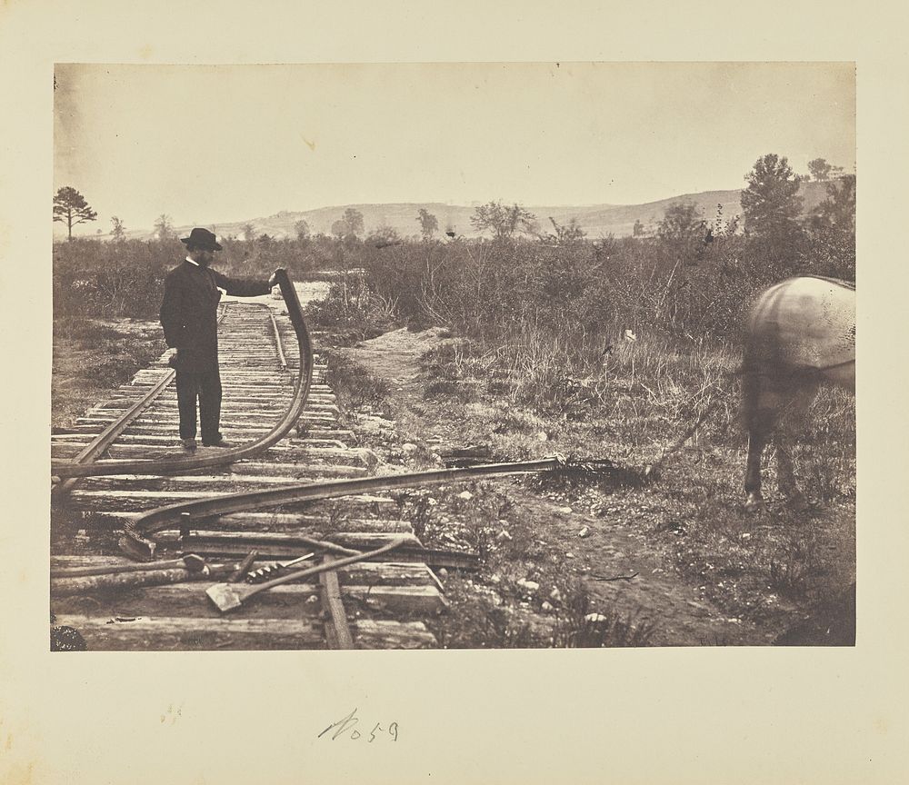 Man holding bent rail by A J Russell