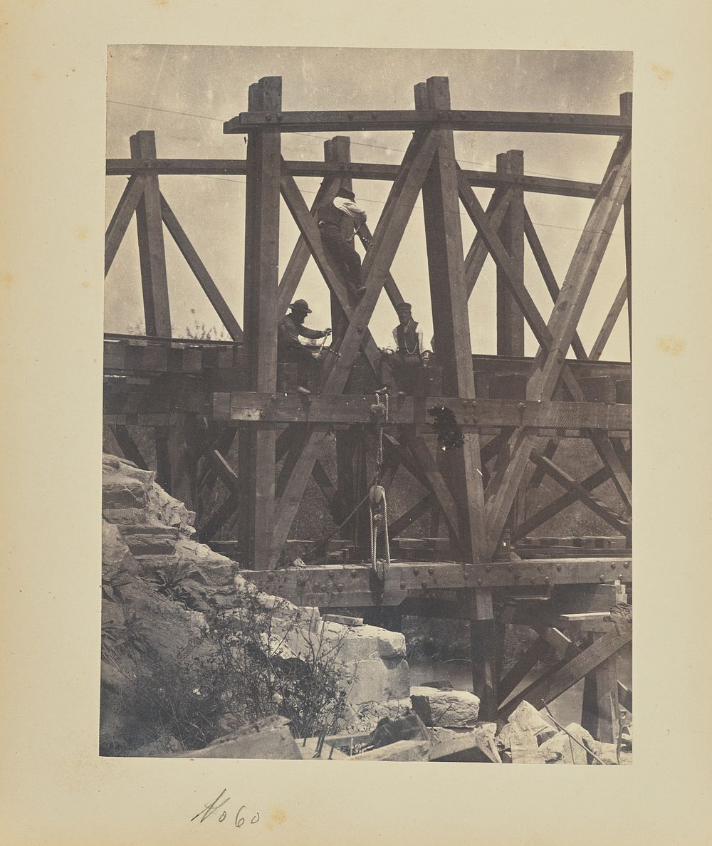 Boring holes in a bridge truss for explosives by A J Russell