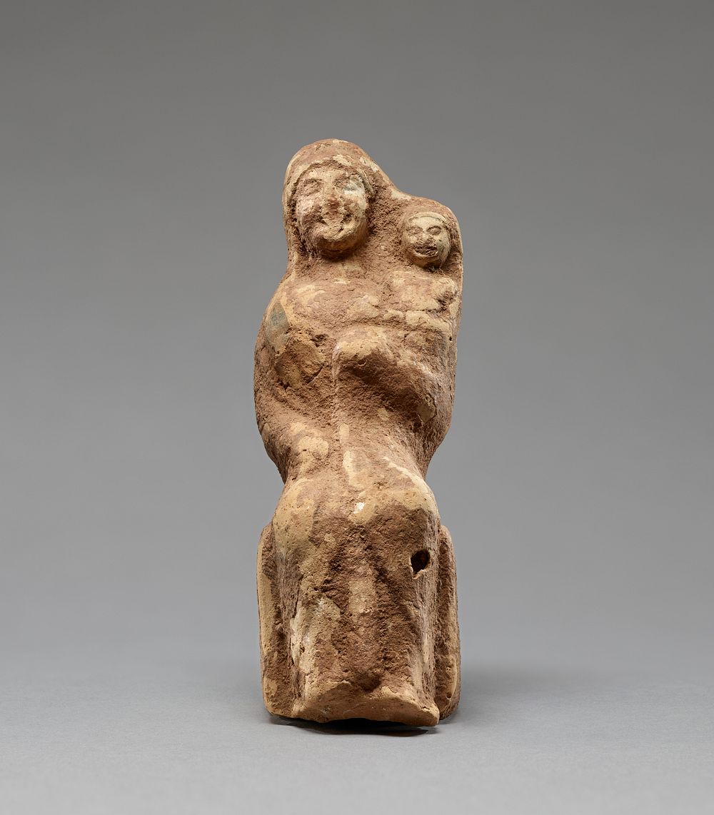 Statuette of a Woman Holding a Young Child in Her Left Arm