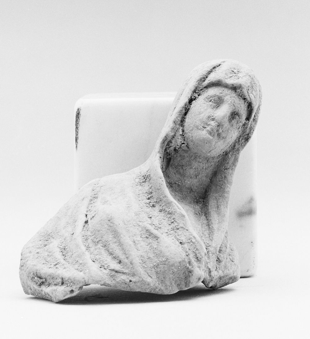 Fragment of a Female Hooded Figurine