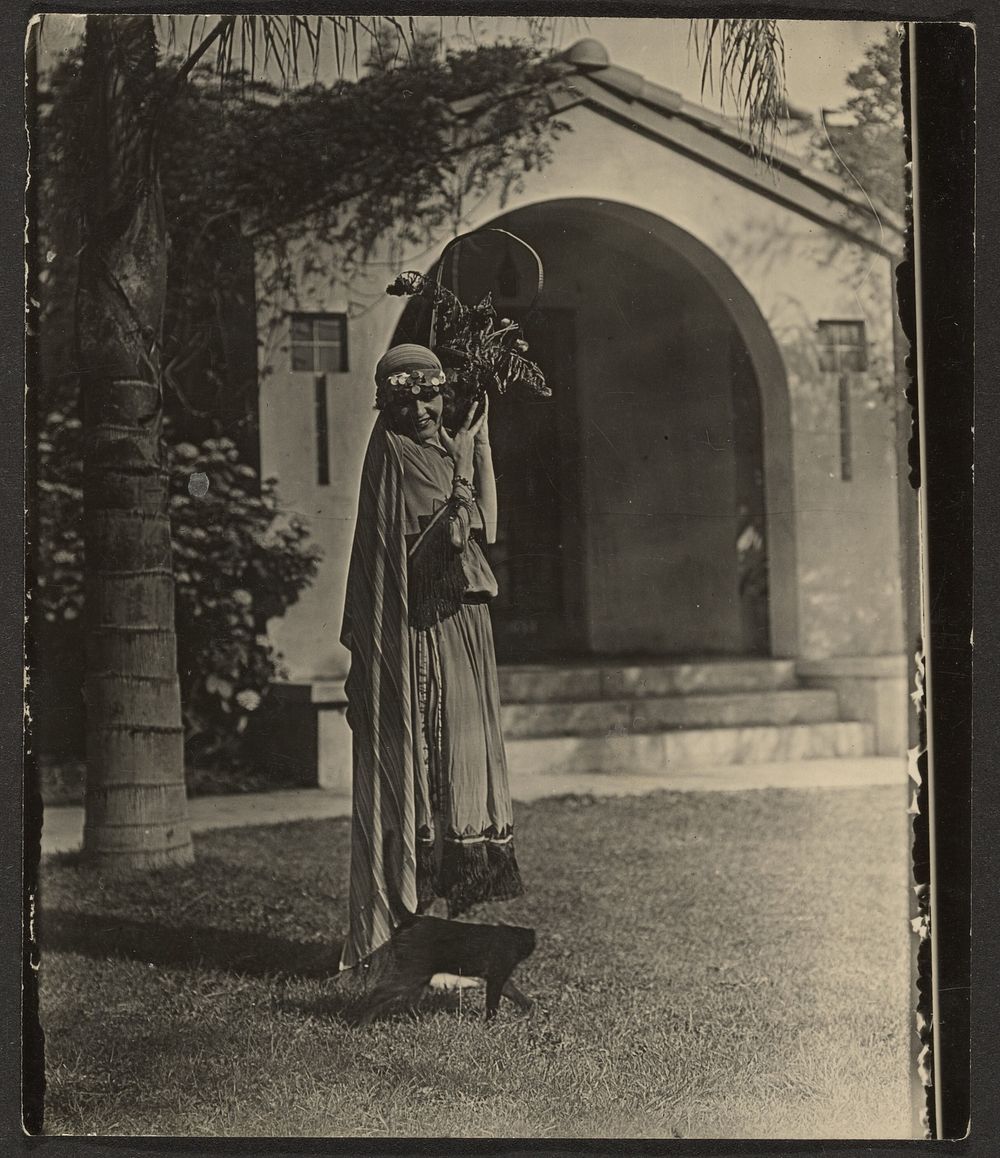 Florence in Costume with Plant Outside House by Louis Fleckenstein