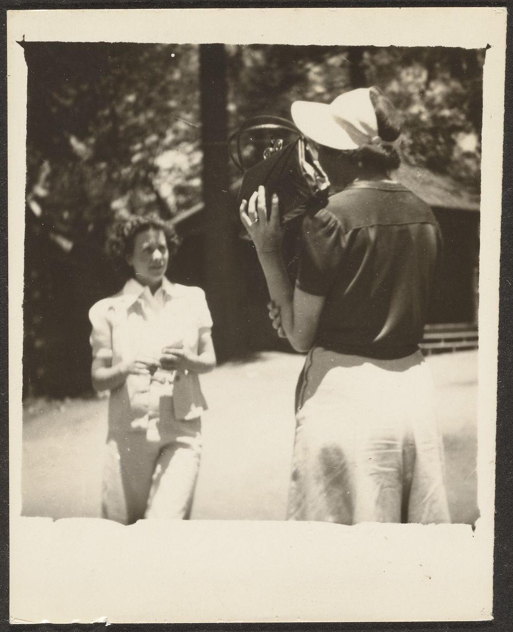 Woman Holding Purse by Face by Louis Fleckenstein