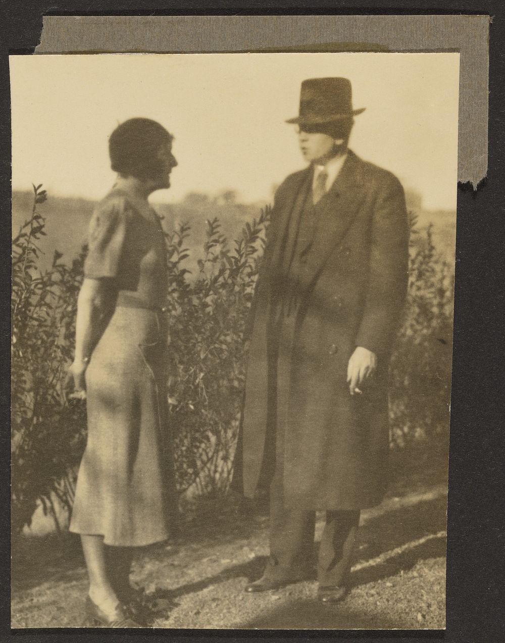 Man and Woman at Hedge by Louis Fleckenstein
