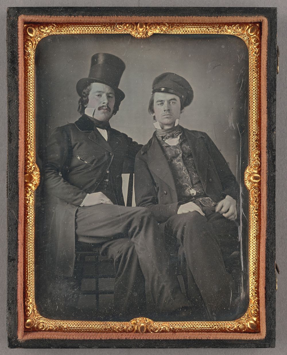 Portrait of Seated Two Men, One in Top Hat, Another in Cap