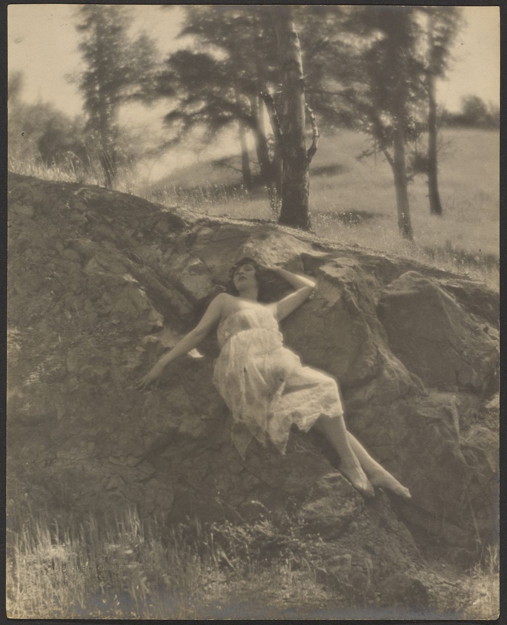 Woman Reclining on Rock Outcrop by Louis Fleckenstein