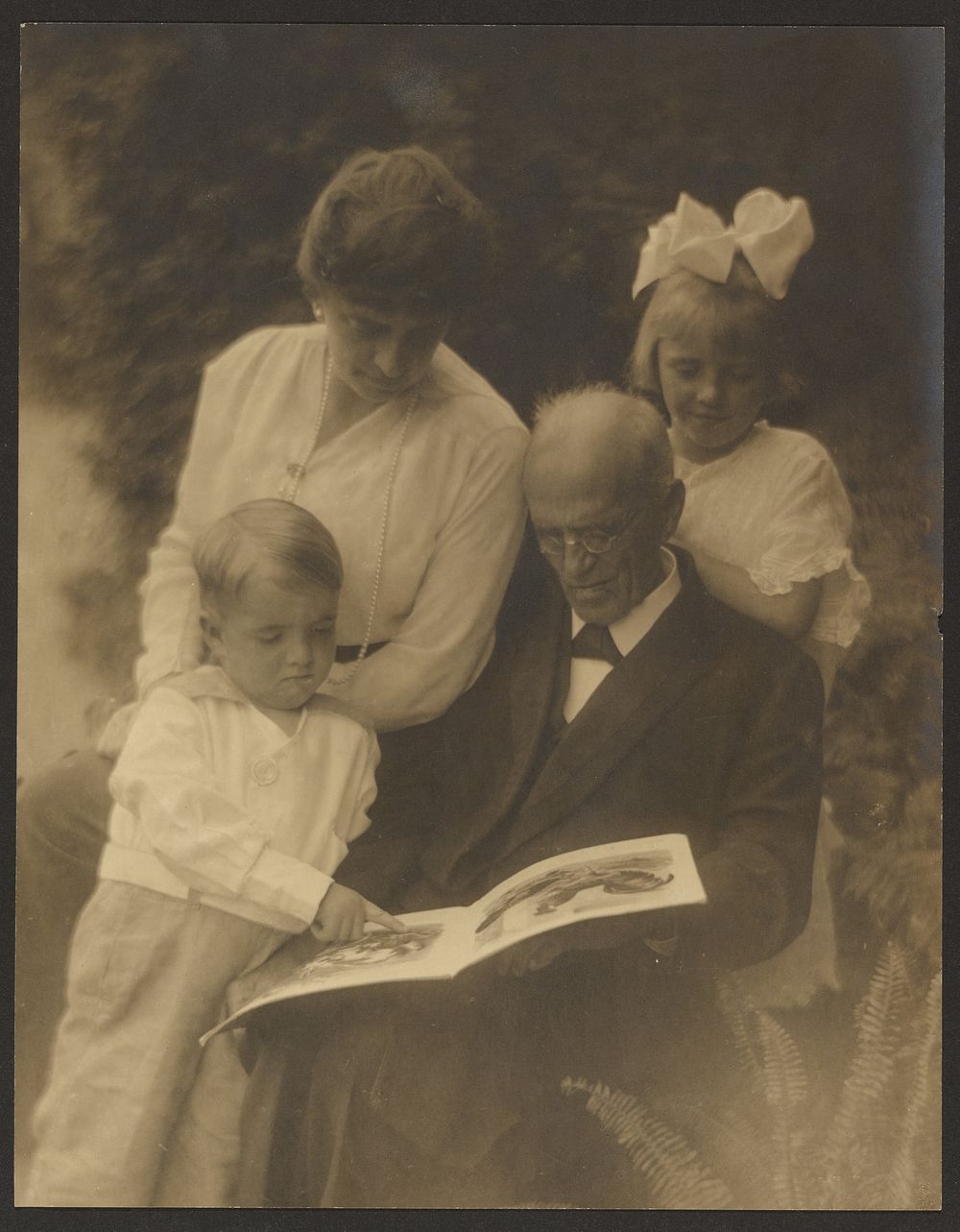 Family Portrait with Picture Book by Louis Fleckenstein