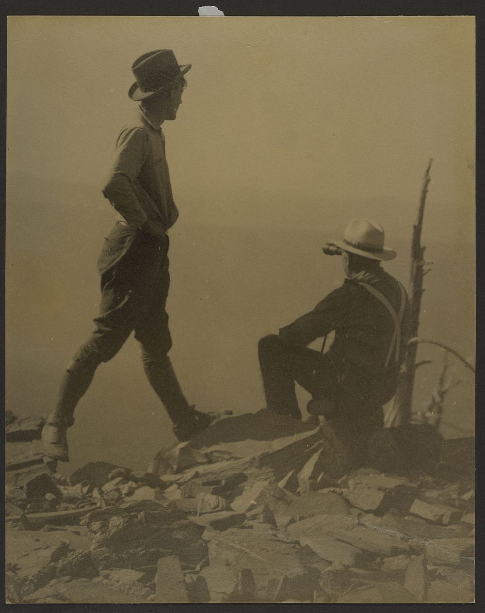 Two Men Looking in the Distance (Possibly Old Baldy Peak) by Louis Fleckenstein