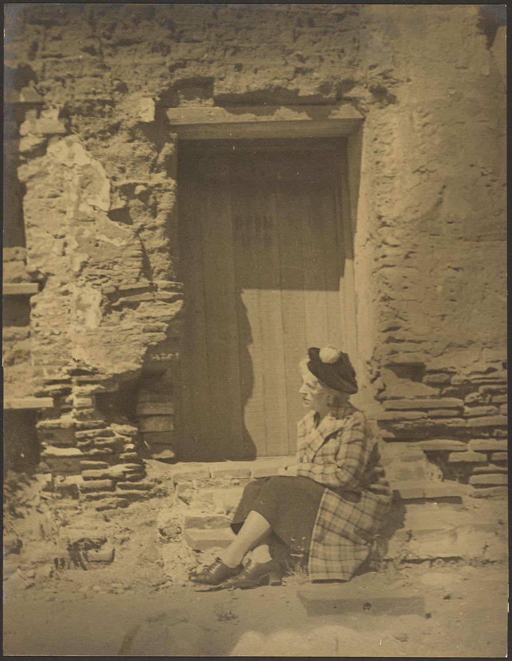 Woman Seated Before Deteriorating Building by Louis Fleckenstein