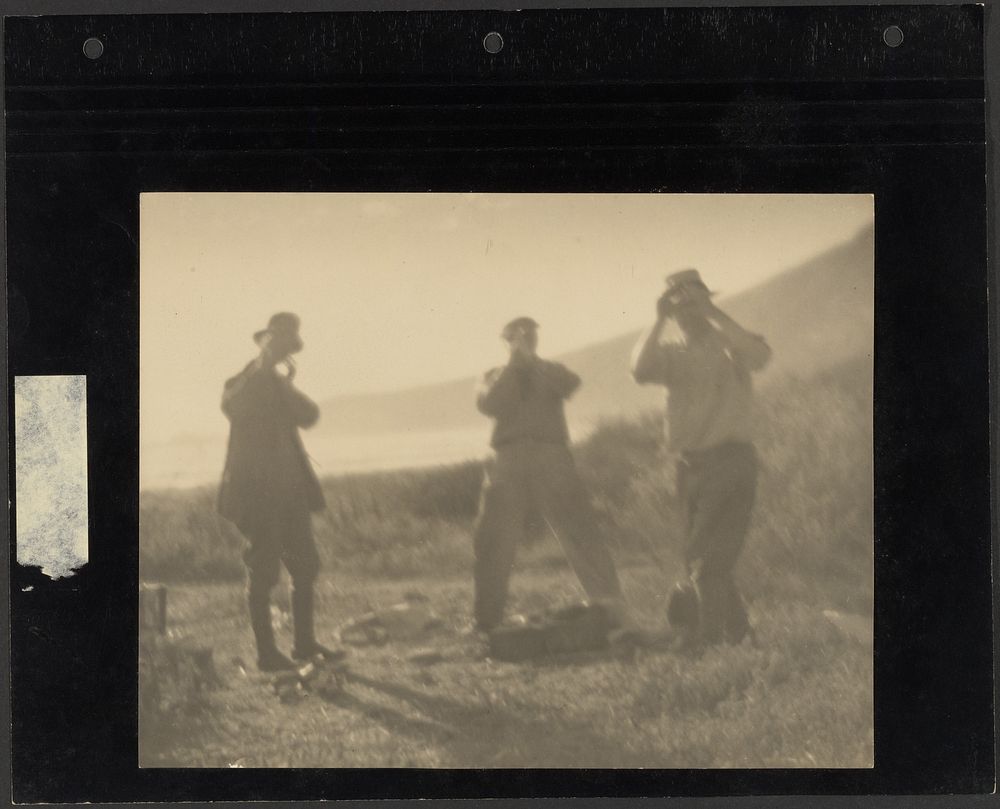 Three Men Standing on Hillside with Hands before Their Faces by Louis Fleckenstein