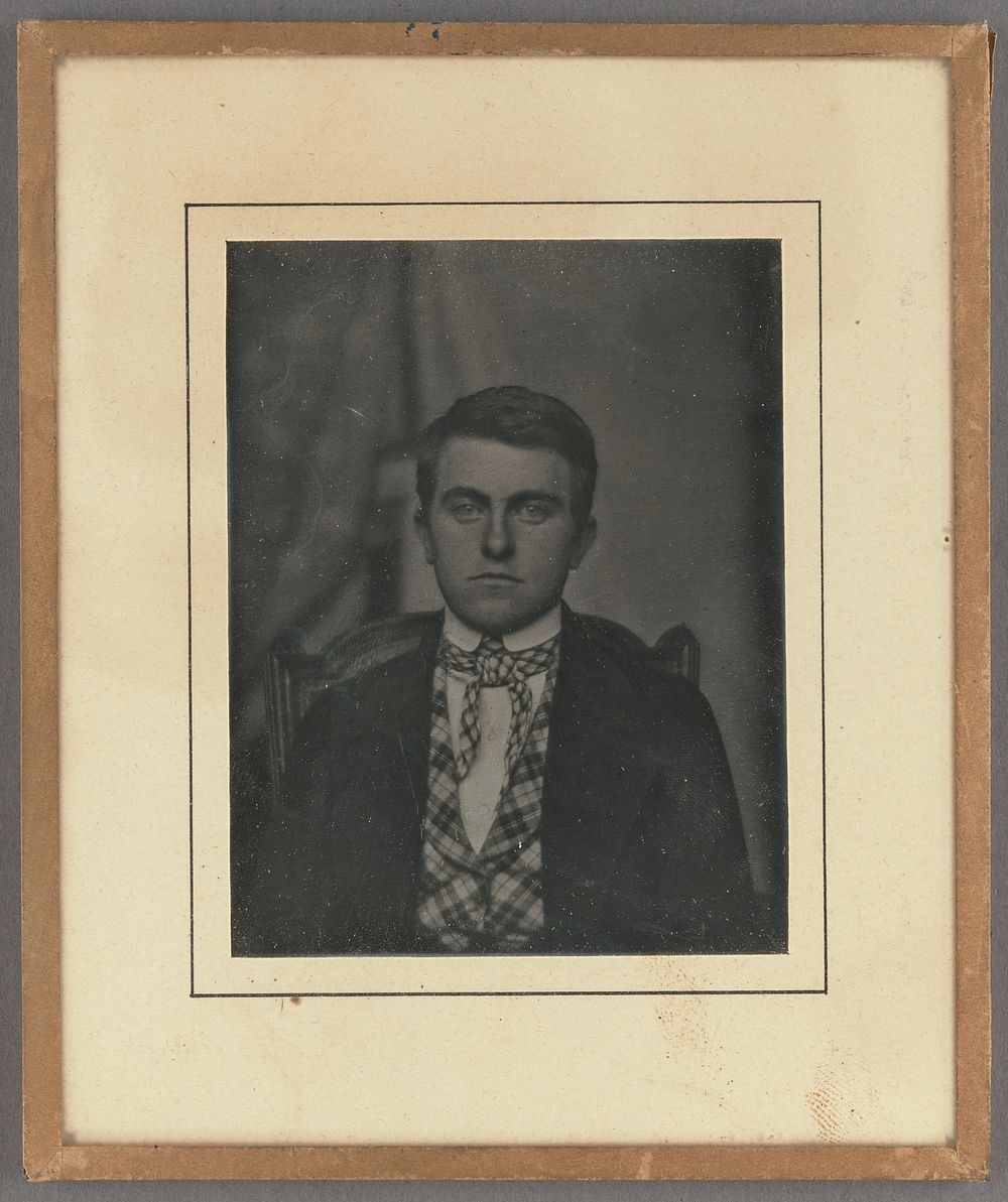 Portrait of a young man wearing a string tie