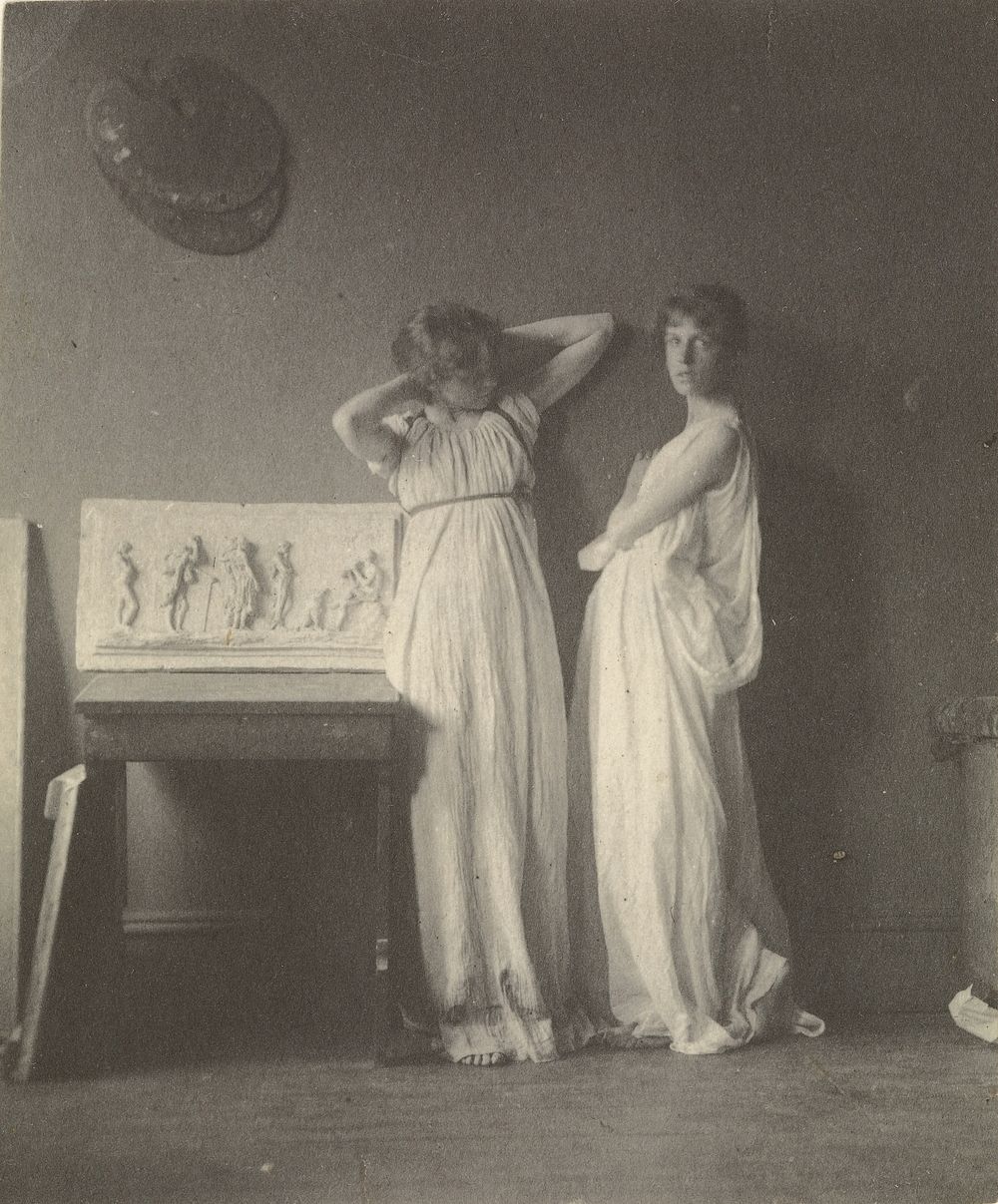 [Two Female Models in Classical Costume with Eakins' Sculpture "Arcadia"]. by Thomas Eakins