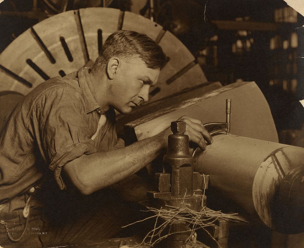 Man with Micrometer Measuring a Shaft to a Thousandth of an Inch. by Lewis W Hine