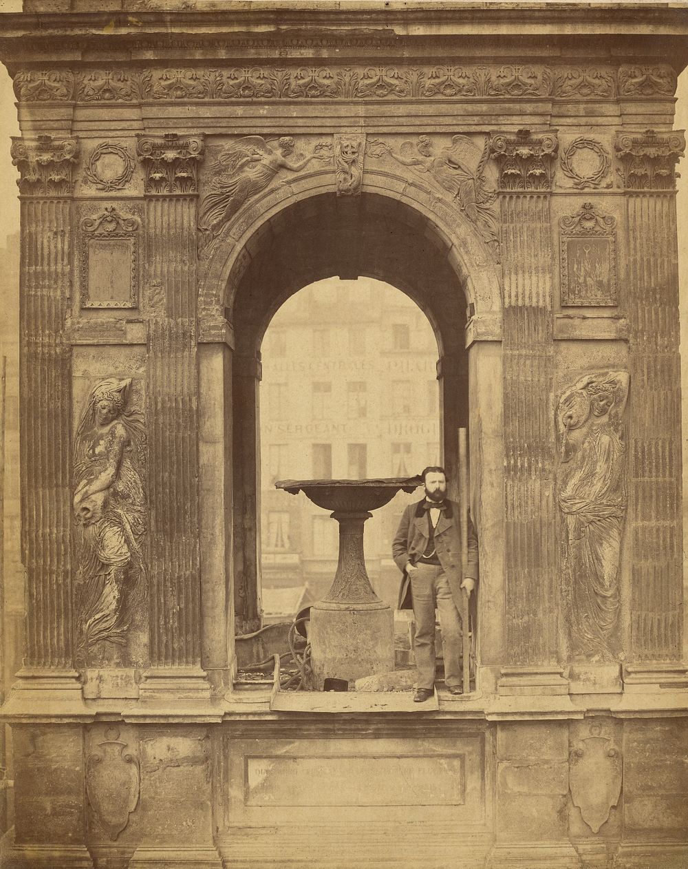 Unidentified Man Posed in Fontaine des Innocents by Charles Marville