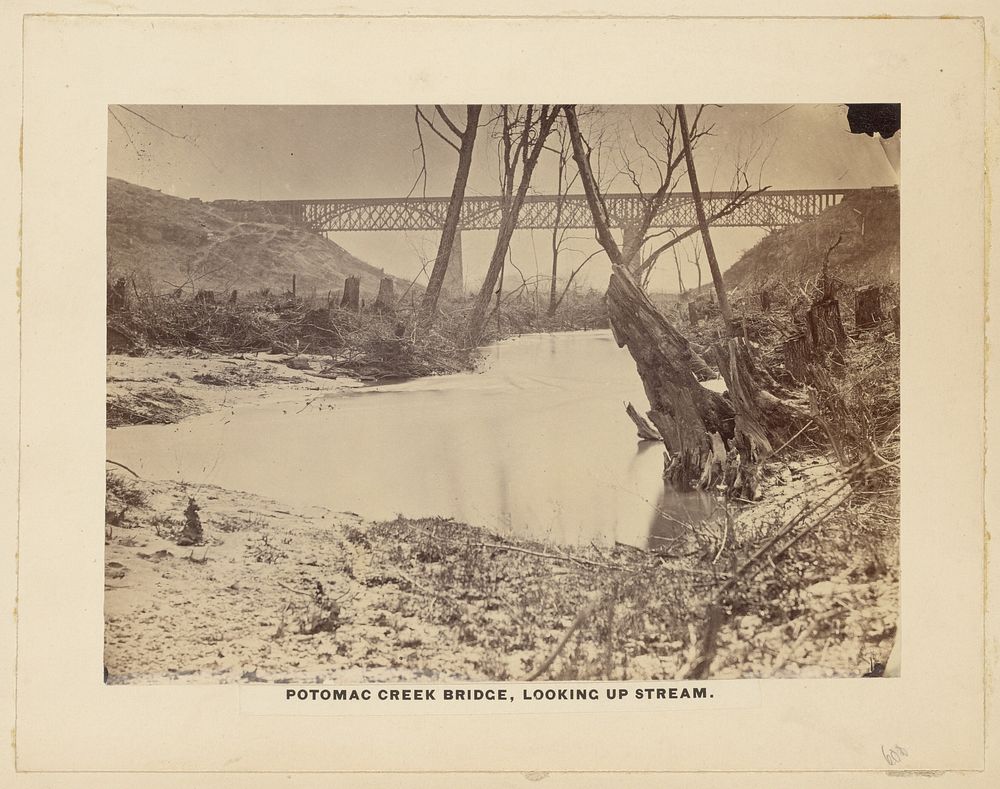 Potomac Creek Bridge, Looking up stream. [April 1863]. by A J Russell
