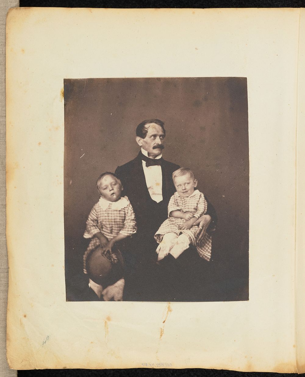 Portrait of a man with two children by Jakob Höflinger