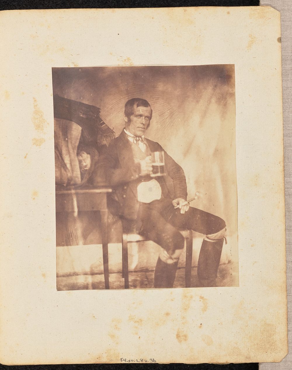 Portrait of a man with a drink by Jakob Höflinger