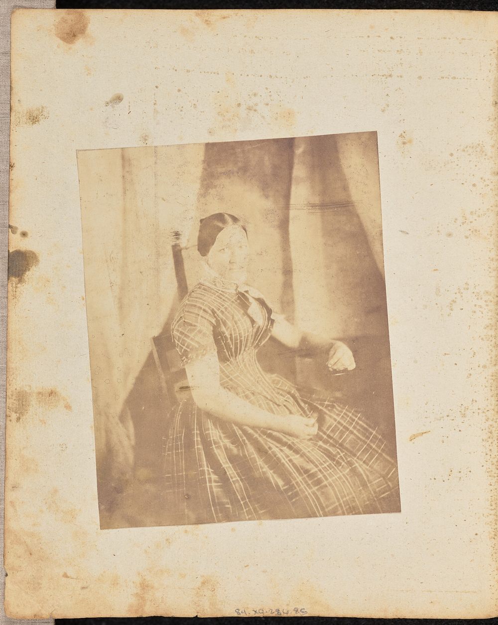 Portrait of a woman in a plaid dress by Jakob Höflinger
