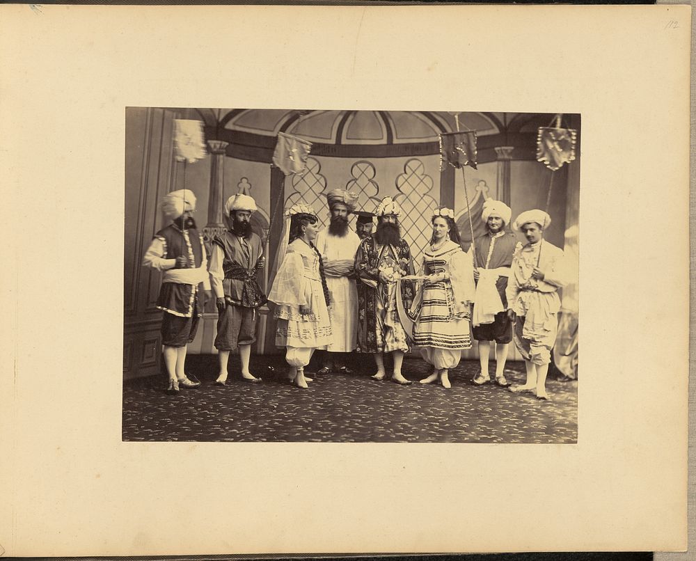 Group portrait of men and women in costumes