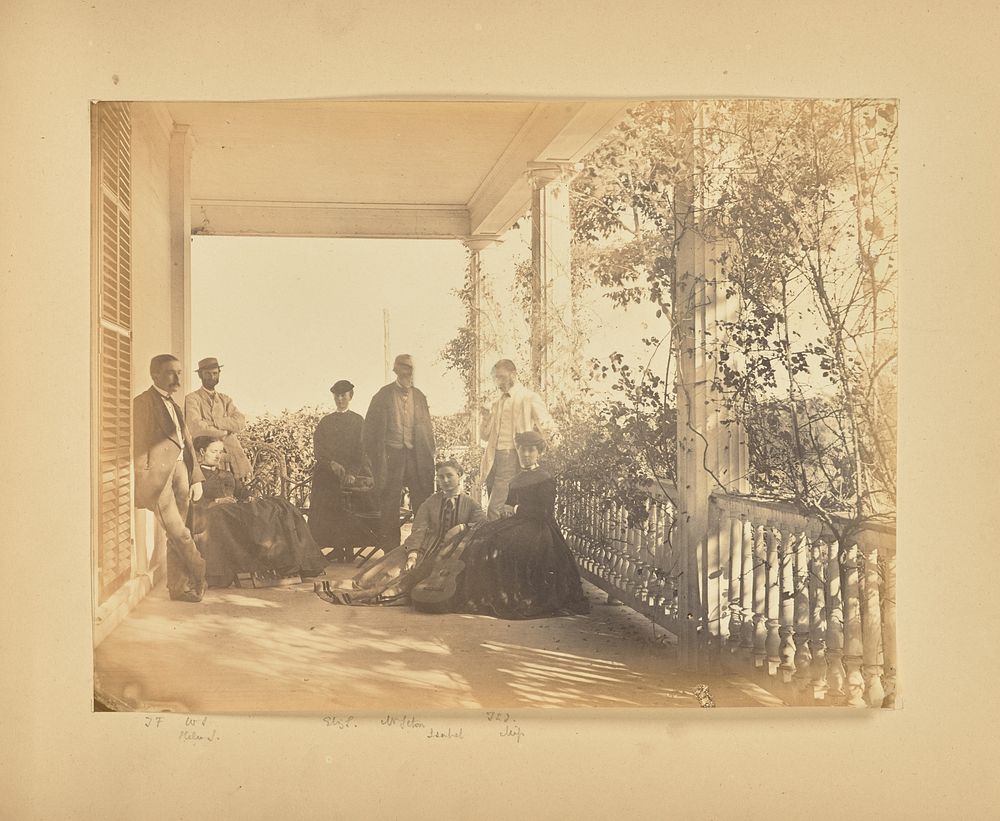 Group portrait on porch by Alfred Booth