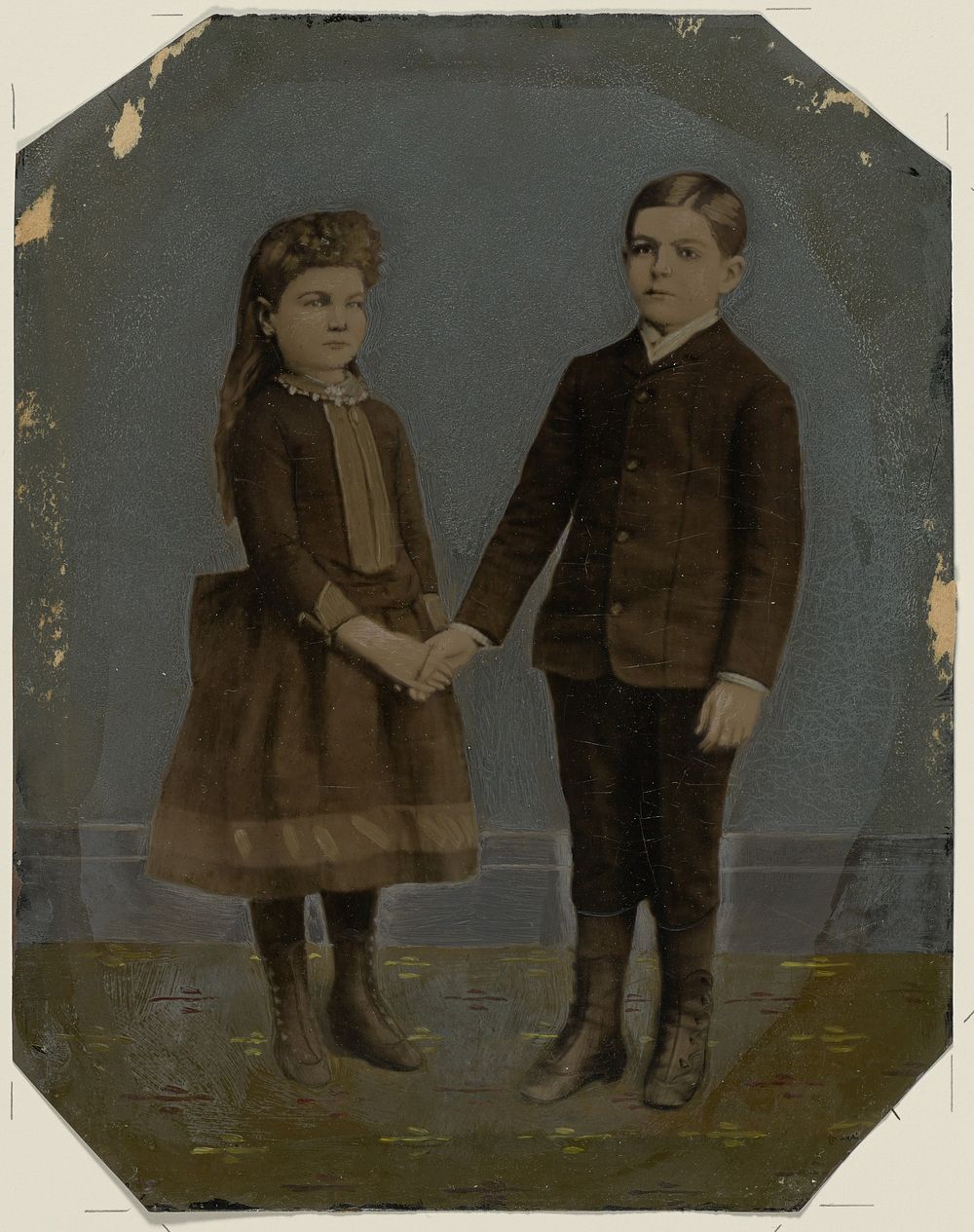 Portrait of boy and girl holding hands