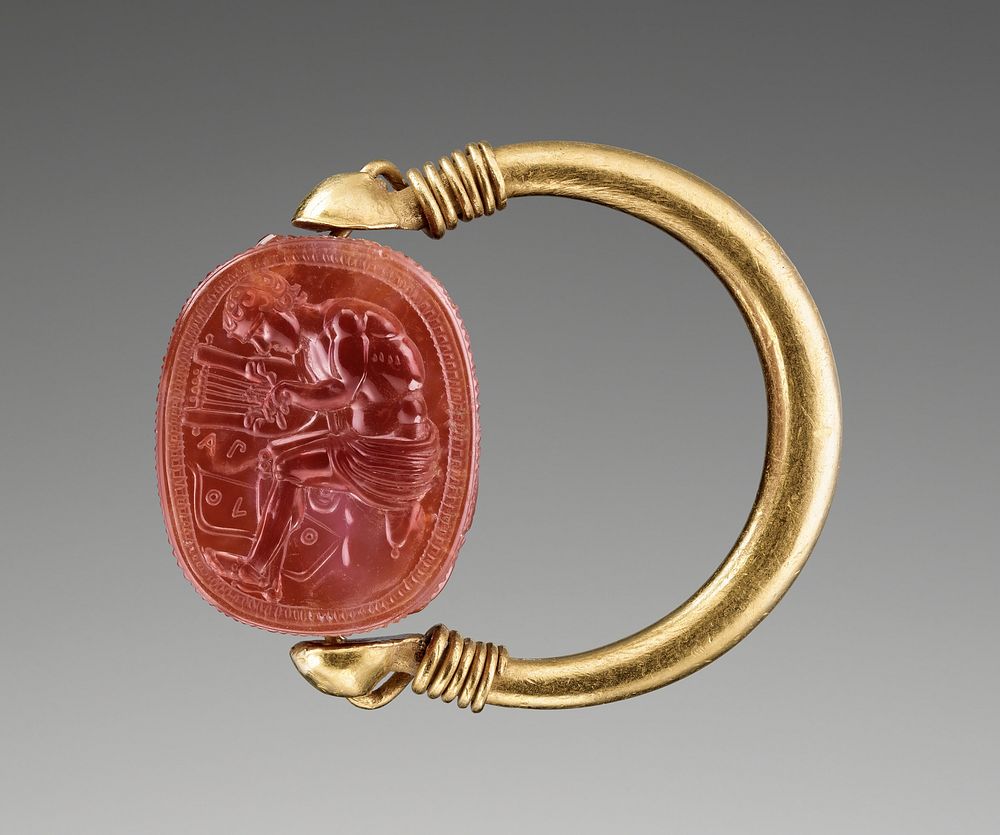 Engraved Scarab with Apollo Playing the Lyre set in a Gold Swivel Ring