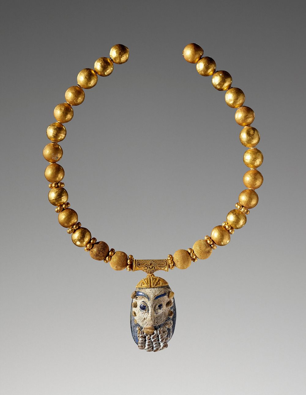 Necklace with a Bearded Head Pendant