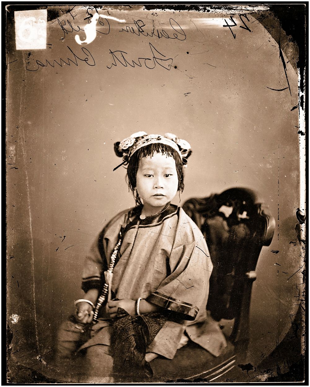 Canton (Guangzhou), Kwangtung province, China: a girl. Photograph by John Thomson, 1869.