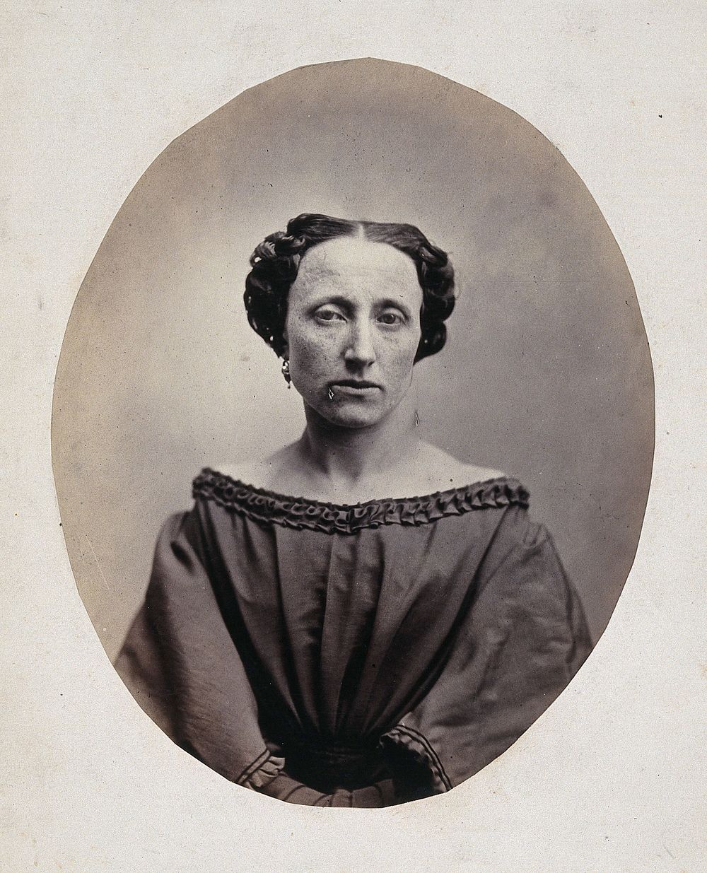 A woman, head and shoulders, viewed from the front. Photograph by L. Haase after H.W. Berend, 1863.
