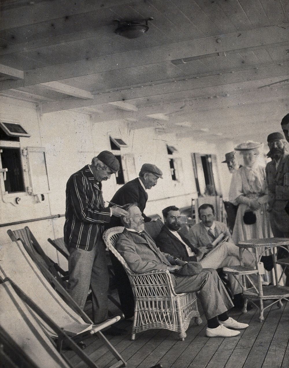 Members of the British Association playing at phrenology on board a ship on its way to South Africa. Photograph by J.T.…
