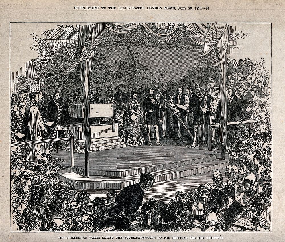 A couple stand on a platform where a large stone is suspended on a chain and a great crowd of people are watching the event.…