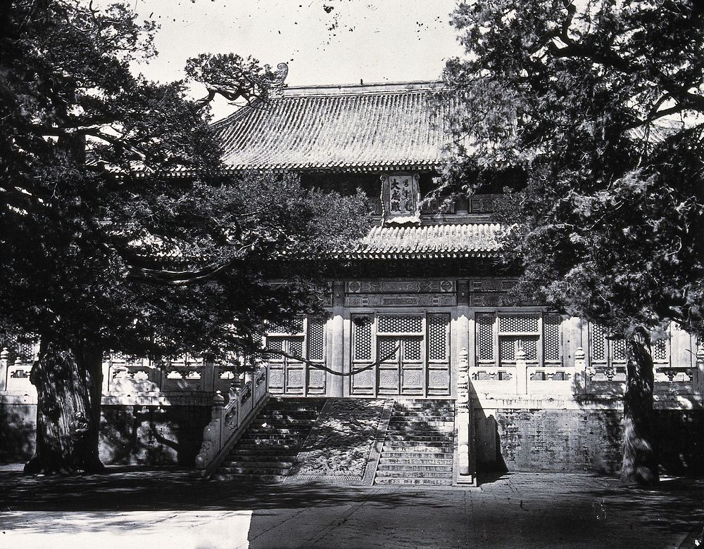 Temple of Confucius (Kong Miao), Peking: Hall of Great Accomplishment (Dachengdian) seen from outside. Photograph, 1981…