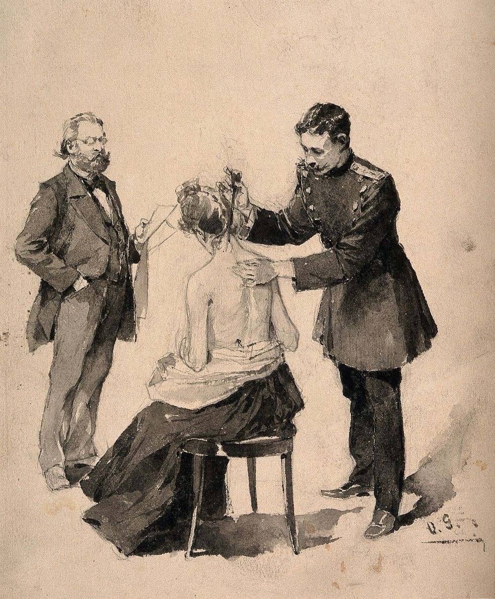 A young physician in military uniform applying an instrument to a woman's neck, while an older man with papers in hand is…